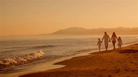 Family Walking Towards Camera On Beach In Stock Footage SBV-300614525 - Storyblocks