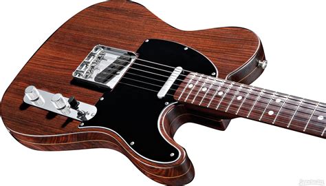 George Harrison sported the first rosewood Telecaster ever crafted during the Beatles' historic ...