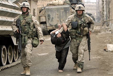 U.S. Marines take away a suspect during the second battle of Fallujah, November 2004. Credit ...