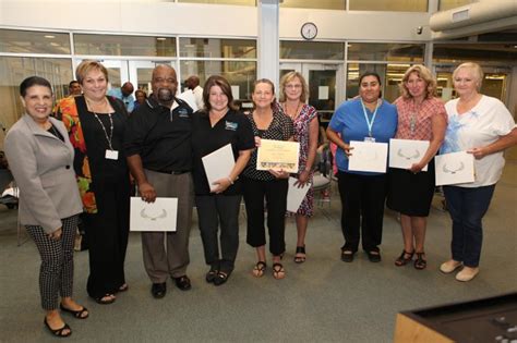 Trustee Rebecca Sandoval (left) with Nutrition Services staff.