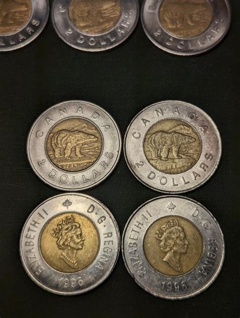 My counterfeit toonie collection with comparison to real ones in the ...