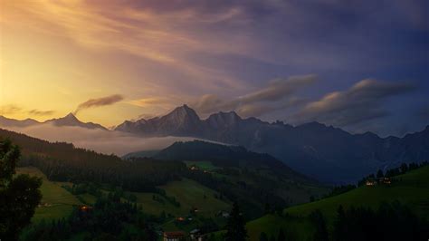 Aerial View Photography of Mountain Under Cloudy Sky · Free Stock Photo