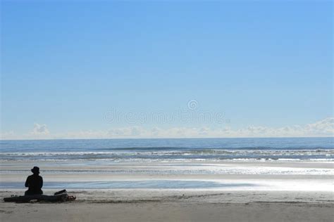 Woman Sitting Alone At Beach Stock Photo - Image: 3023210