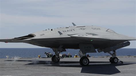 Navy launches jet-sized drone from aircraft carrier for first time - CBS News