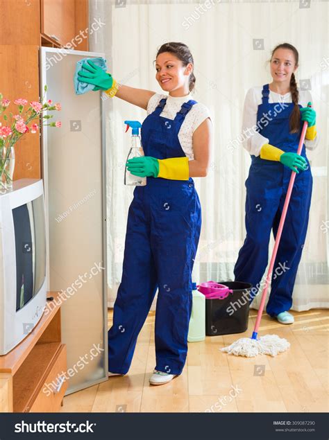 Positive Smiling Professional Cleaners Uniform Cleaning Stock Photo ...