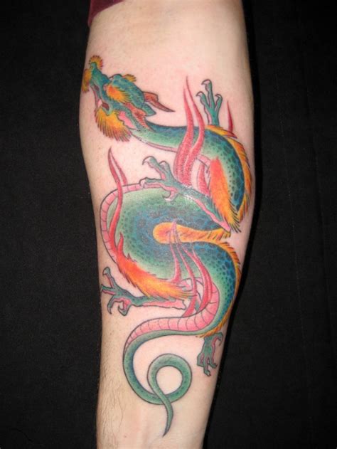 Vivid-colored chinese dragon tattoo on forearm - Tattooimages.biz