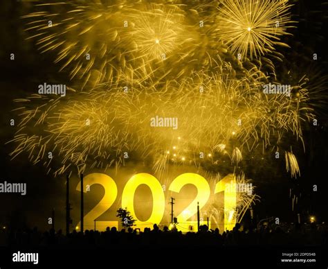 Happy new year 2021 card on a golden fireworks background Stock Photo ...