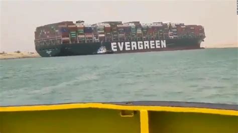 Massive container ship runs aground in Suez Canal, creating traffic jam ...