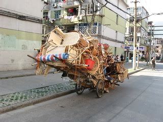 400_9438 | A hand cart loaded up with wicker chairs | bricoleurbanism | Flickr