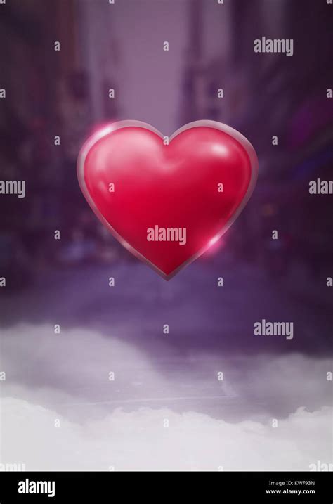 Shiny heart glowing with purple city misty background Stock Photo - Alamy