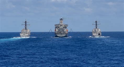 USNS Guadalupe (T-AO 200) refueling two Burkes at the same time ...