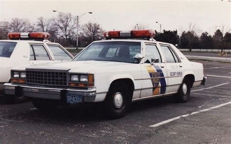 two police cars parked in a parking lot