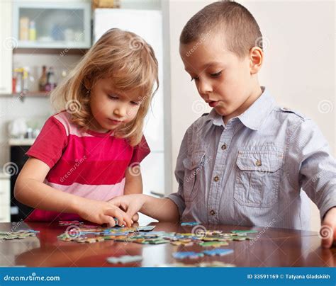 Kids, playing puzzles stock image. Image of children - 33591169