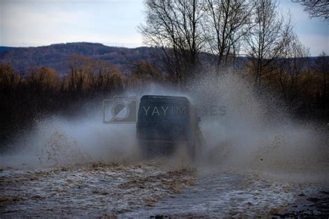 Motion the wheels tires and off-road. Track on mud. Travel concept with big 4x4 car. Tracks on a ...