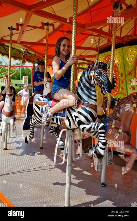 Young girl enjoying the Carousel in Nickelodeon Universe at Kings ...