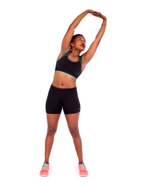 Athletic Woman Doing Side Bend Stretch for Stomach and Obliques