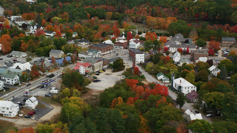 5.5K stock footage aerial video orbiting small rural town with colorful foliage, autumn, Paris ...