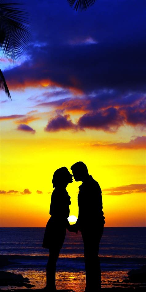 Download 1080x2160 wallpaper kiss, couple, sunset, beach, silhouette, art, honor 7x, honor 9 ...