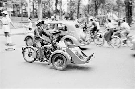 Street scene in Saigon in 1950 Street scene with pedicabs in Saigon Motorized pedicab in Saigon ...