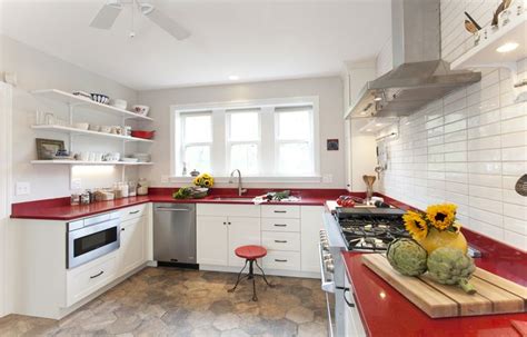 Unique kitchen with red countertops, crisp white cabinetry, and a ...