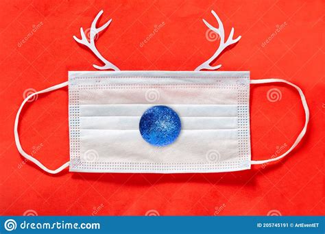 Festive Christmas Reindeer Made from Face Mask on Red Stock Image - Image of season, blue: 205745191