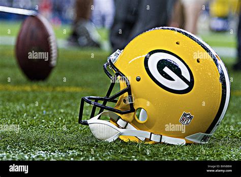 Green Bay Packers Helmet and Football on the field Stock Photo - Alamy
