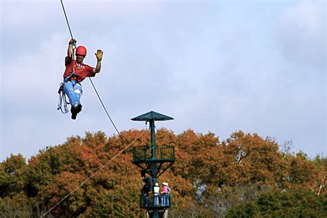 Zip line guide | A guide riding the zip line. Long zip lines… | Flickr