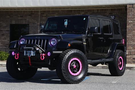 '16 Lifted Jeep with Rockstars & PINK accents - Trinity Motorsports