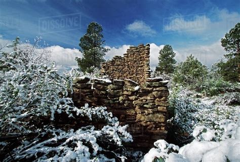 Indian Ruins Wall Built From Stone And Mud With Fresh Snow - Stock Photo - Dissolve