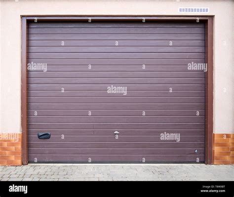 The entrance to the garage is equipped with a roller shutter gate Stock ...