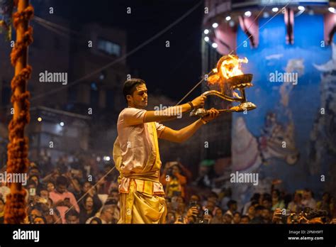 Ganga aarti, Portrait of an young priest performing river ganges ...