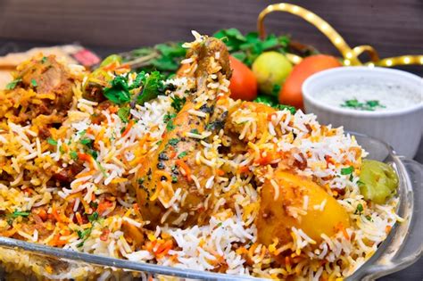 Premium Photo | Pakistani style spicy chicken biryani with raita