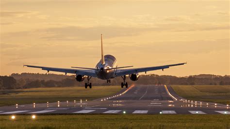 Airplane Taking Off Sunset