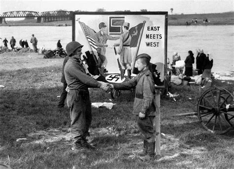 Start of the Cold War: A soldier with the 1st U.S. Army shakes hands ...