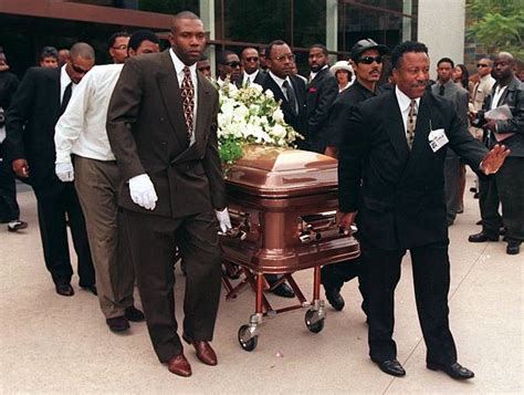 Pall bearers take the body of Florence Griffith Jo Pictures | Getty Images