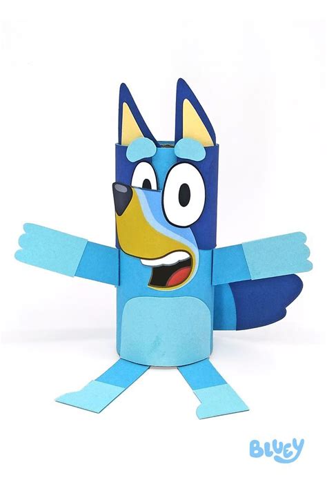 an origami dog with big eyes and blue body is standing on one leg