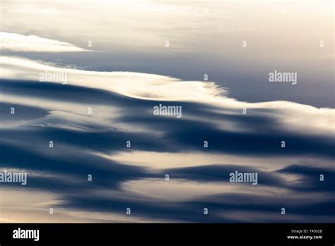 Sea of clouds on a sunset sky Stock Photo - Alamy