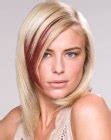 Blonde hair with red and orange color effects created with hair extensions