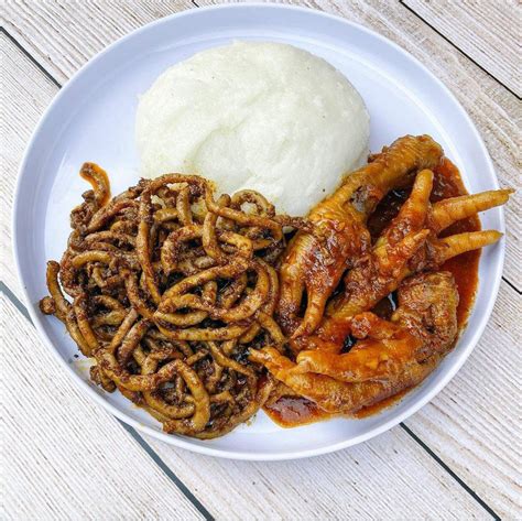 This is chicken feet cooked in tomato gravy and fried chicken stomach with pap. : r/FoodPorn