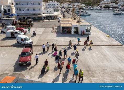 Tourists Boarding the Ferry in Port of Ios Island. Cyclades, Greece ...