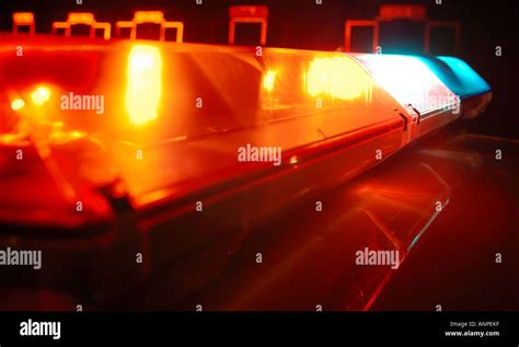 Police lights illuminated on car Stock Photo - Alamy