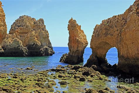 Coastal rock formations and sea arch at Ponta Da Piedade Photograph by Kevin Richardson | Fine ...