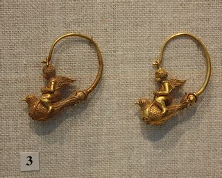 Pair of gold hoop earrings with Erotes riding doves | Flickr