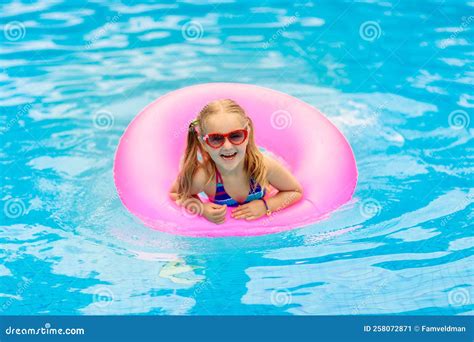 Child in Swimming Pool on Toy Ring. Kids Swim Stock Image - Image of ...