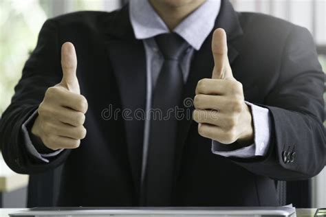 Businessman in Suit Giving Thumbs Up at Office Desk Stock Image - Image of business, desk: 192403539