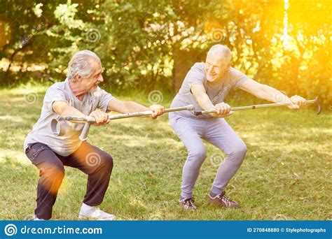 Two Seniors Train Squats As a Fitness Exercise Stock Photo - Image of ...