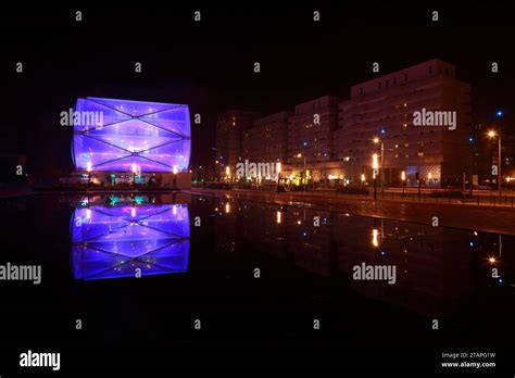 Water Mirror and Le Nuage building by night designed by Philippe Starck , Parvis Stephane Hessel ...