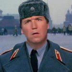 Tucker Carlson in Moscow, Russian hat, Putin suckup Meme Generator - Imgflip