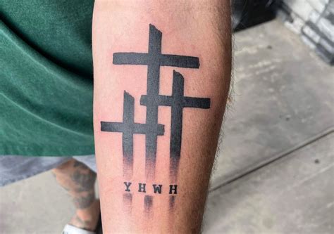 The Hidden Symbolism Behind the 3 Crosses Tattoo | Regretless
