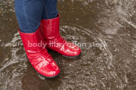 Stock Photo: Red Rain Boots and Pavement Puddle - Body liberation for ...